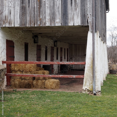 The hay has been stacked in the front part of the barn. photo