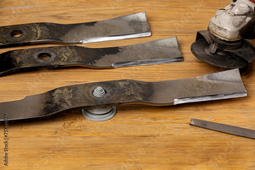 Obraz na plátně Sharpening and balancing dull lawnmower blades