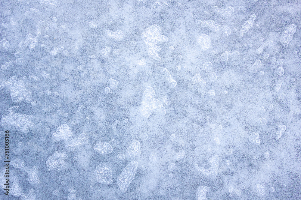 Authentic ice surface, texture of the frozen surface of a lake, river.