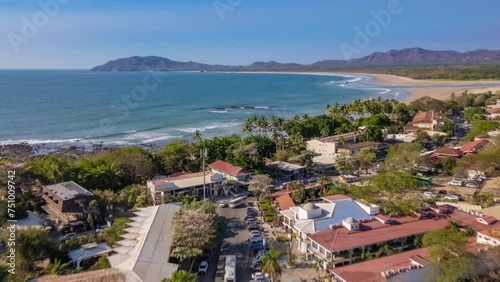 Daytime town of Tamarindo in Costa Rica Hyperlapse aerial with ocean and town skyline
