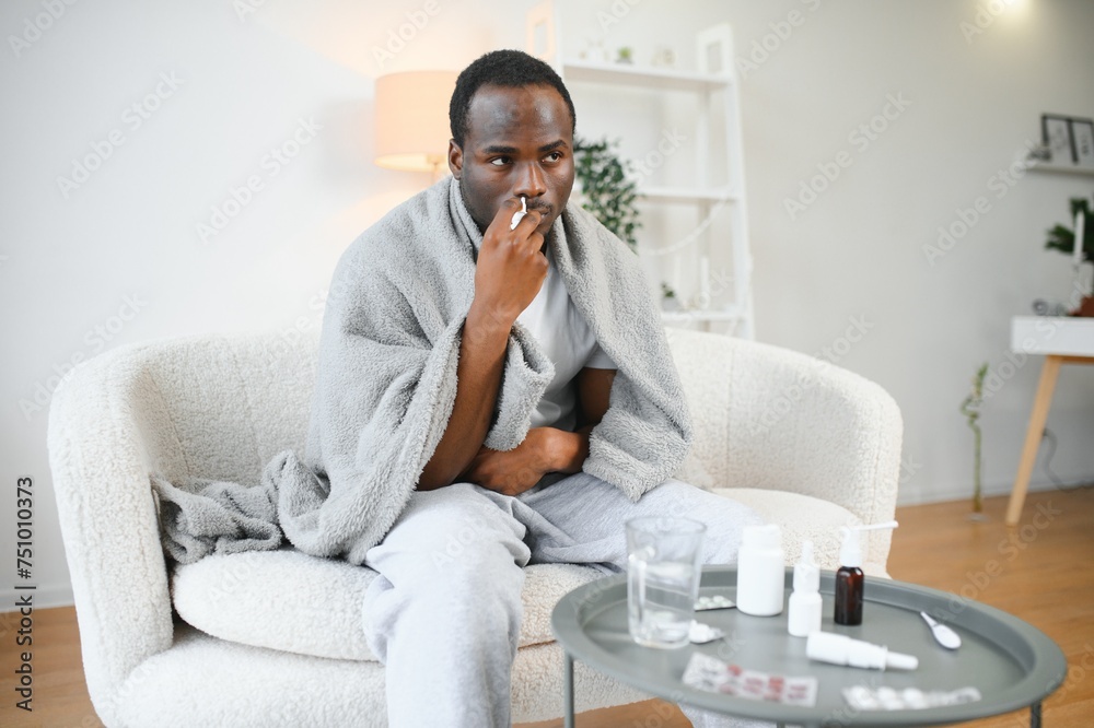 Cold And Flu Treatment. Sick African American Man Using Nasal Spray Cold And Flu Treatment. Sick African American Man Using Nasal Spray