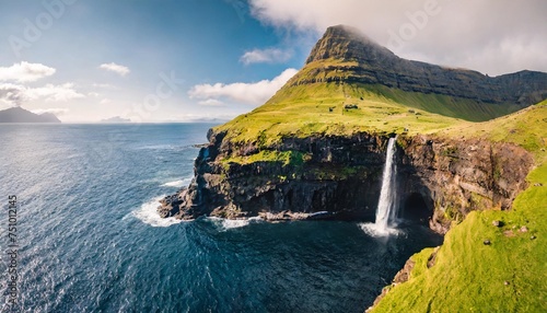 view from flying drone majestic morning scene of mulafossur waterfall stunning summer view of vagar island faroe islands denmark europe photo