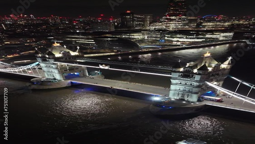 tower bridge of London vertical descending aerial video at night 4k 60p photo