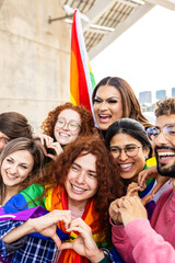 Vertical photo of diverse young people having fun together celebrating gay pride festival day. LGBT community concept.