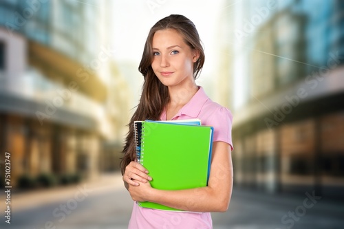 Portrait of lady student posing outdoors