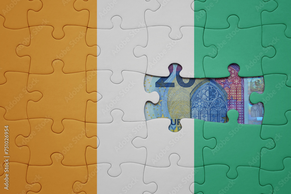 puzzle with the national flag of cote divoire and euro banknote. finance concept