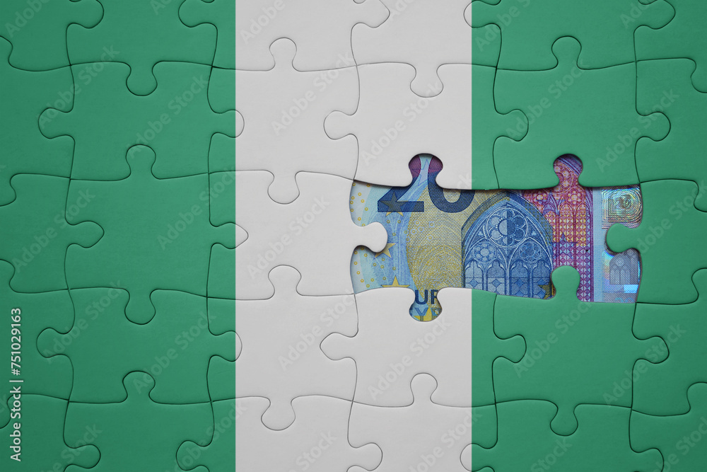 puzzle with the national flag of nigeria and euro banknote. finance concept