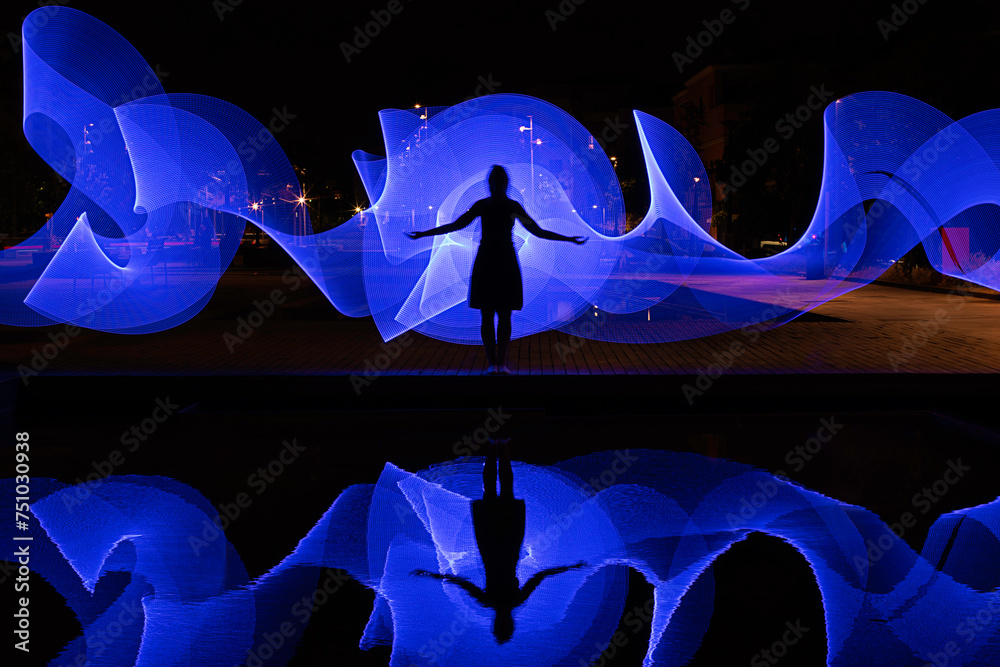 © CACTUS Creative Studio/Stocksy - Woman silhouettes with light painting