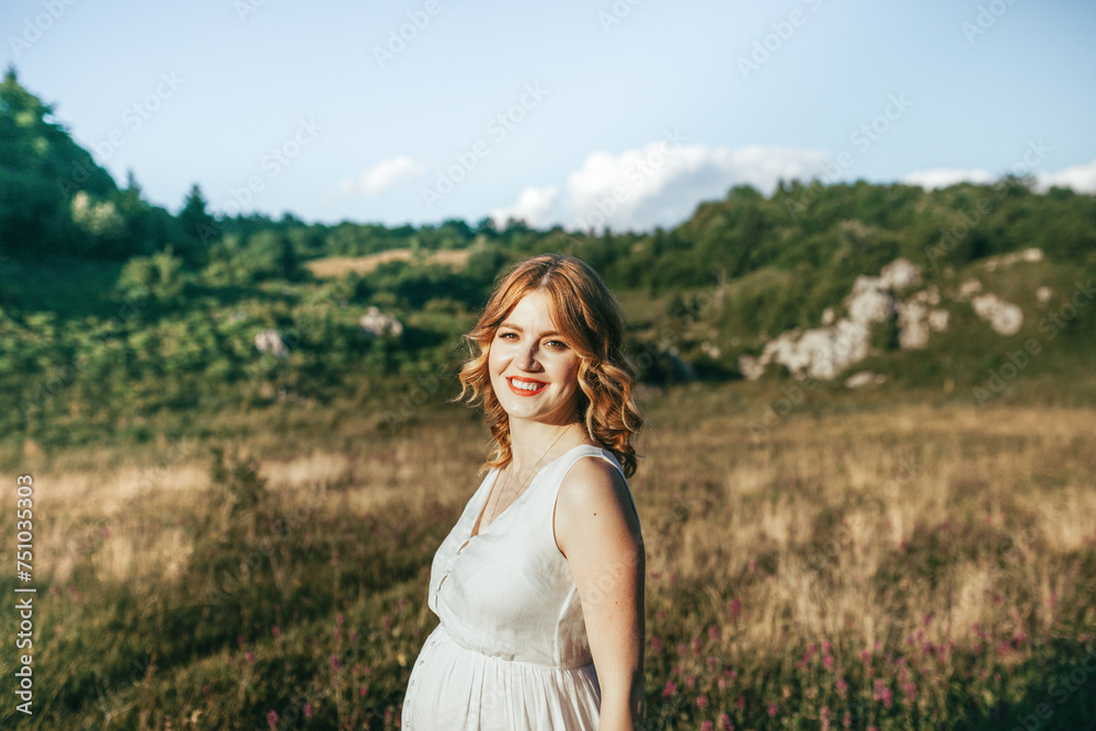 Nature portrait of a cheerful woman in a white dress
Nature portrait of a cheerful woman in a white dress
