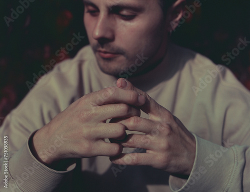A young anxious male portrait in autumn
