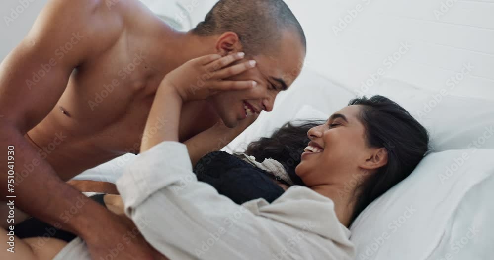 Happy couple, relax and kissing on bed for morning, romance or love in embrace, trust or care at home. Young man and woman smile lying in bedroom for intimacy, passion or bonding together at house Happy couple, relax and kissing on bed for morning, romance or love in embrace, trust or care at home. Young man and woman smile lying in bedroom for intimacy, passion or bonding together at house