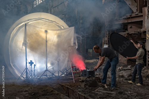 Lighting assistants work on horror films production photo