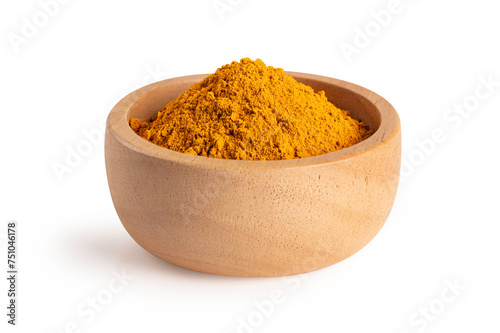 Indian spice. Turmeric powder in a wooden bowl on white