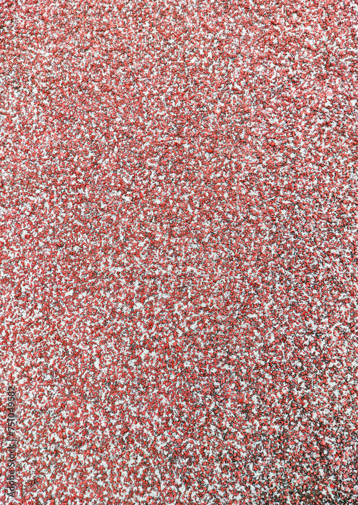 Close-up textured red background of rubber running track