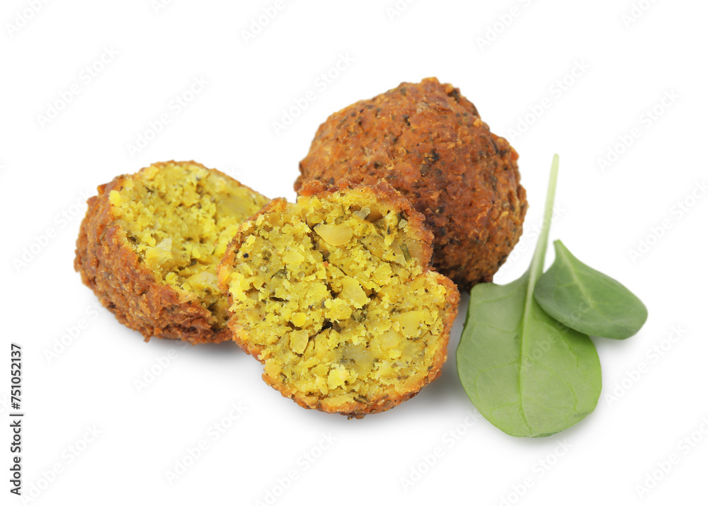 Delicious falafel balls and basil isolated on white Delicious falafel balls and basil isolated on white