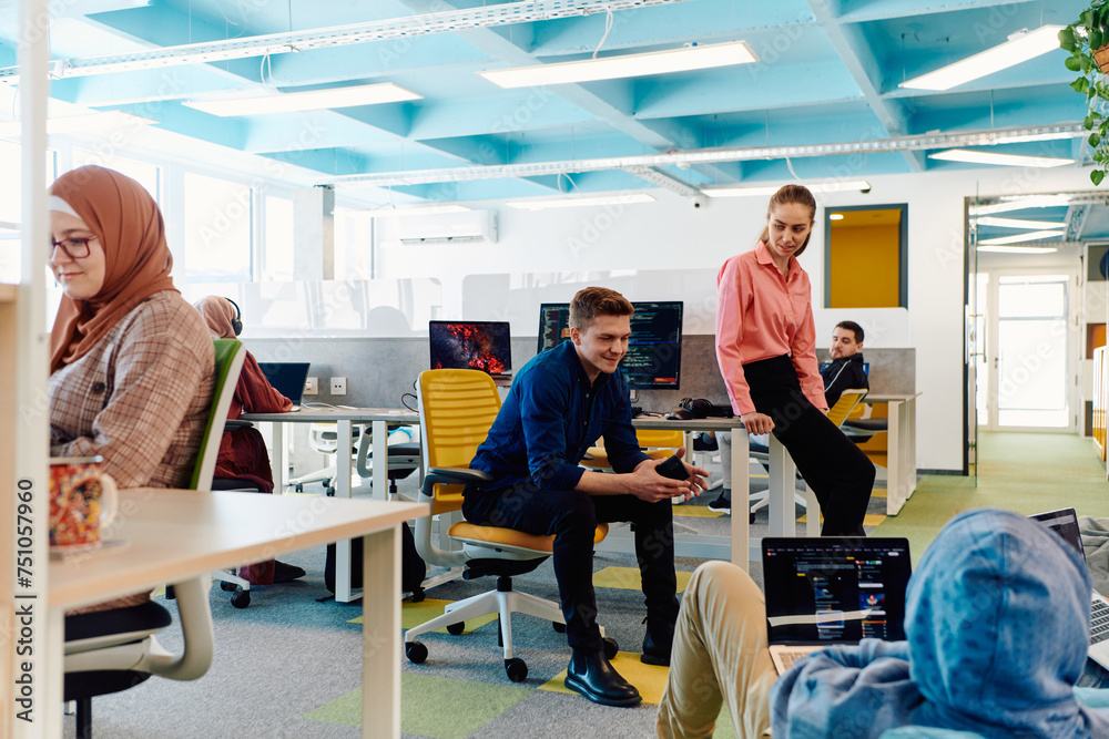 In a modern startup office, a diverse group of young and capable businesspeople engage in lively discussions about various projects, showcasing teamwork, innovation, and entrepreneurial spirit In a modern startup office, a diverse group of young and capable businesspeople engage in lively discussions about various projects, showcasing teamwork, innovation, and entrepreneurial spirit