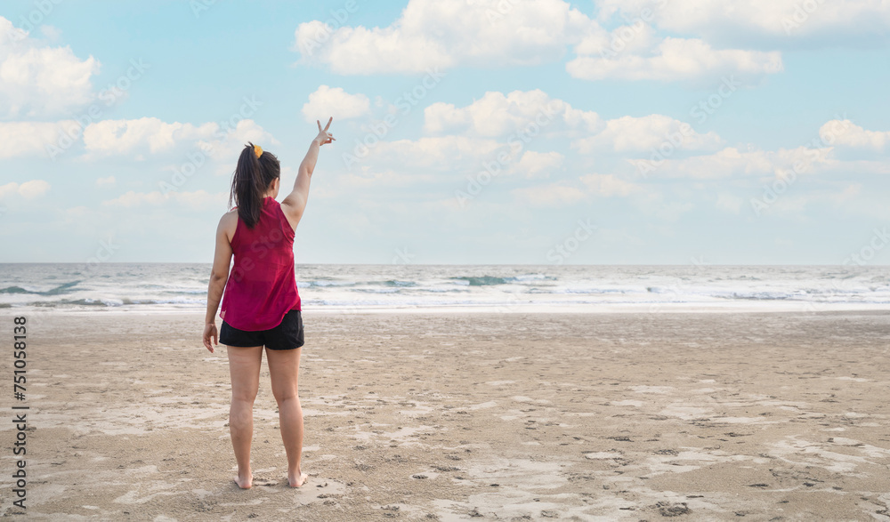 Summer beach vacation concept, happy woman raising hands up on sea beach background. Summer beach vacation concept, happy woman raising hands up on sea beach background.