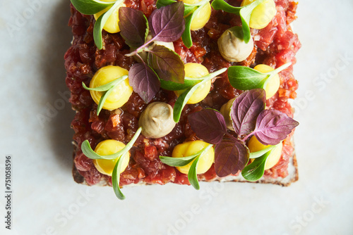 Steak tartare on a bread in fine dining restaurant photo