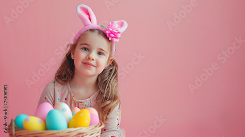 Beautiful girl holds in hand a basket with Easter eggs