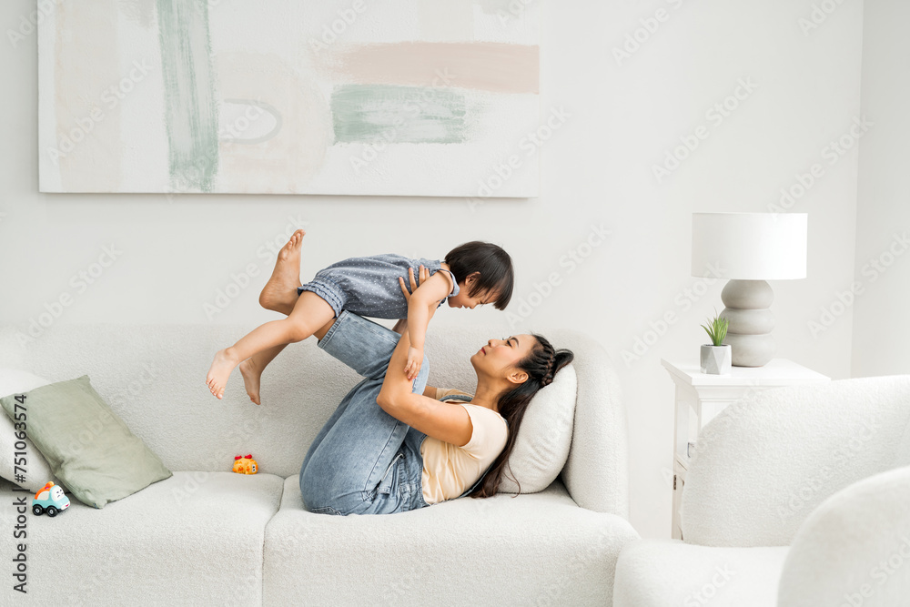 Joyful family practicing balance doing yoga exercises Joyful family practicing balance doing yoga exercises