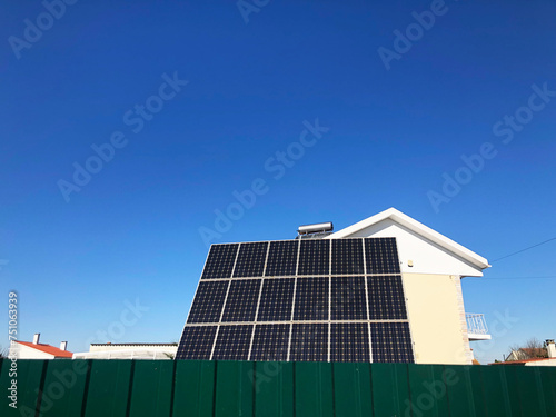 UGC house with solar panel in blue sky photo