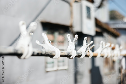 Set of clothes hangers located on a clothesline pole photo