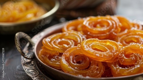 Jalebi: Deep-fried pretzel-shaped sweet made from batter and dipped in syrup.Ramadan Desserts.