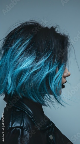 Close-up of a woman with a black and blue bob cut hairstyle. Creative and attractive hairstyle in black and blue color in modern and stylish trend.