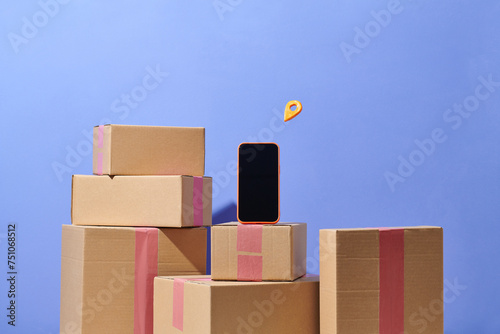 Pile of beige carton boxes with smartphone screen photo