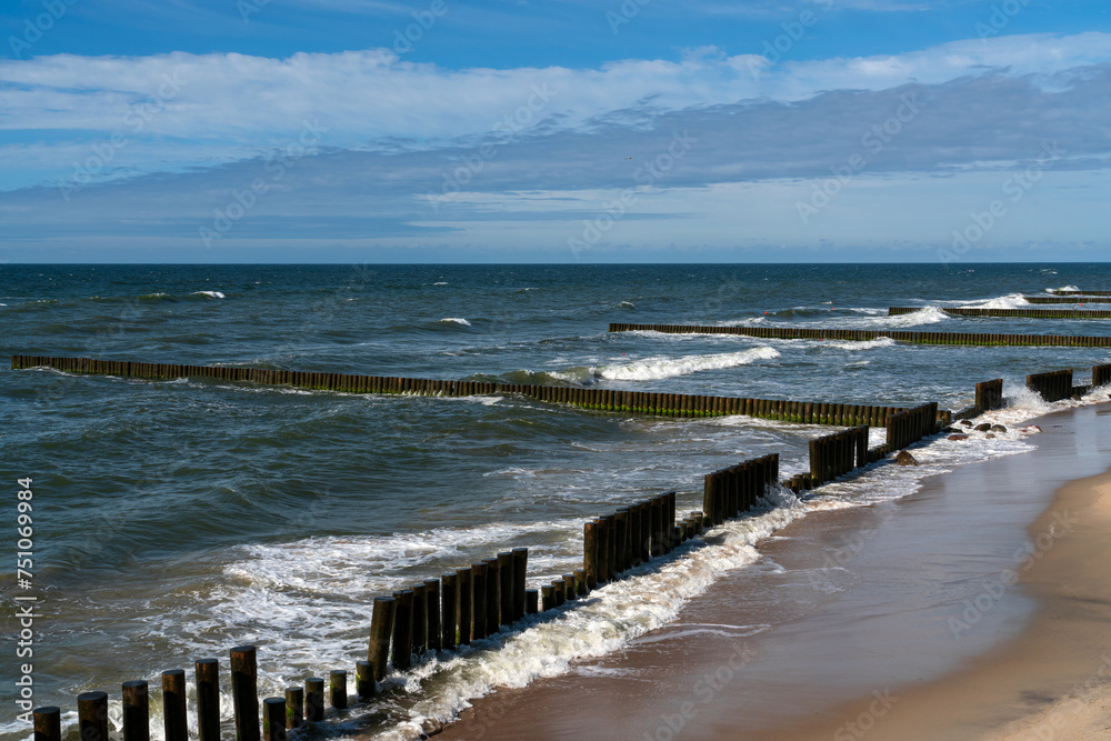 View of the Baltic Sea and wooden breakwaters of the city beach on a summer day, Svetlogorsk, Kaliningrad region, Russia