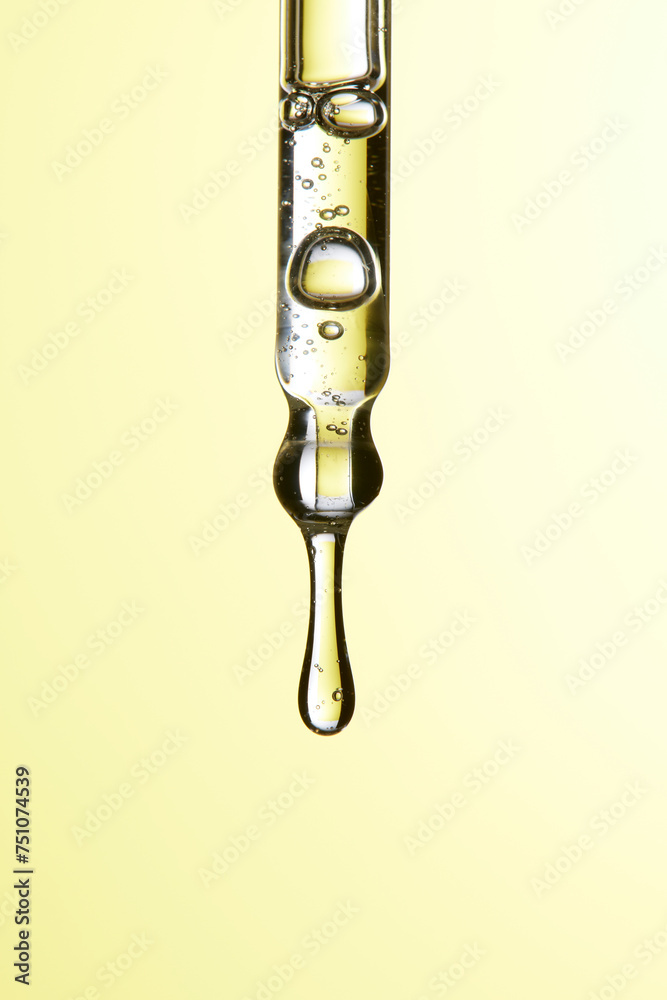 Clear liquid droplets falling from a dropper that can be used for cosmetic and medical images. Clear liquid droplets falling from a dropper that can be used for cosmetic and medical images.
