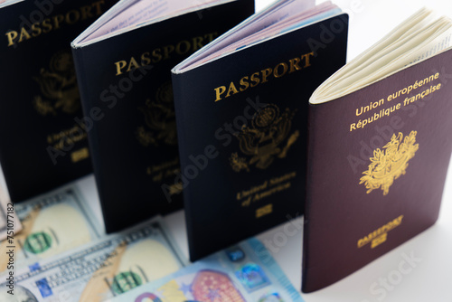 3 United States and 1 France passport on visable currency transparent background photo