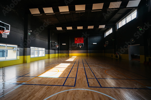 Basketball court with sunlight on the floor photo
