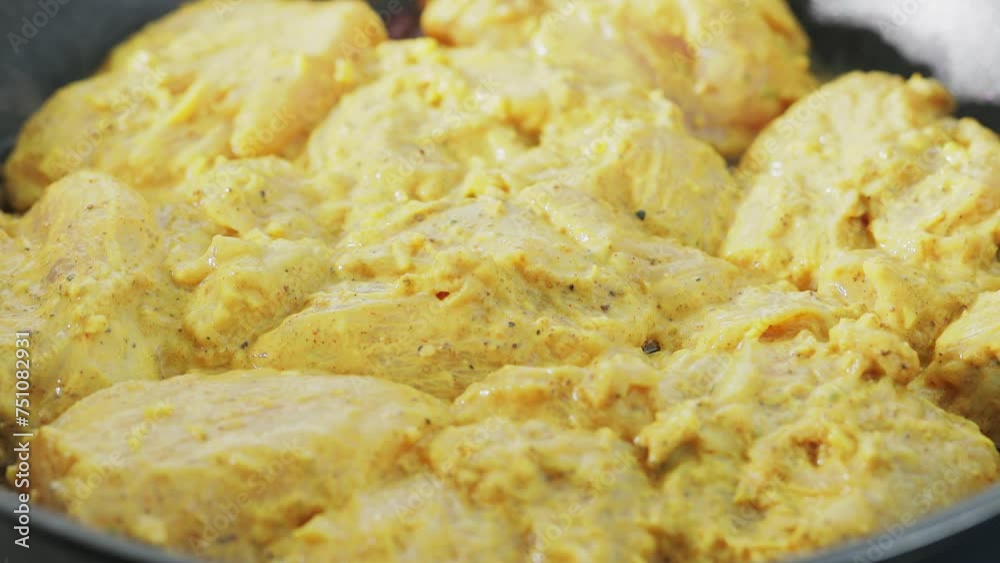 Frying Marinated Chicken for Indian Chicken Biryani, Close-Up Shot Frying Marinated Chicken for Indian Chicken Biryani, Close-Up Shot