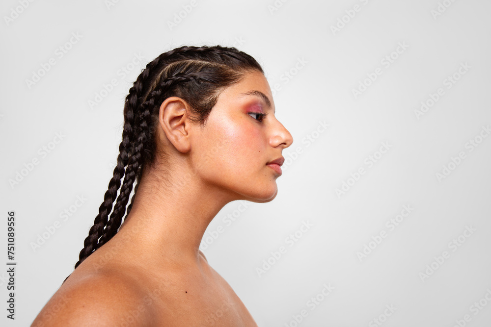 Profile of a young woman with braided hairstyle Profile of a young woman with braided hairstyle