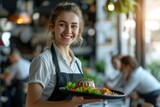 Waitress in Caucasian restaurant smiling happily holding a tray of food to serve customers.