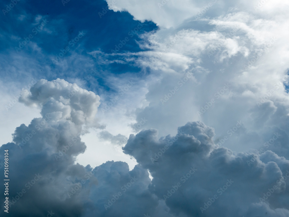 Blue sky fluffy white clouds on summer season bright clear skyline with beautiful cloudscape. Panorama blue sky clouds pattern on daylight with copy space. Cumulus cloudscape air climate sunny day Blue sky fluffy white clouds on summer season bright clear skyline with beautiful cloudscape. Panorama blue sky clouds pattern on daylight with copy space. Cumulus cloudscape air climate sunny day