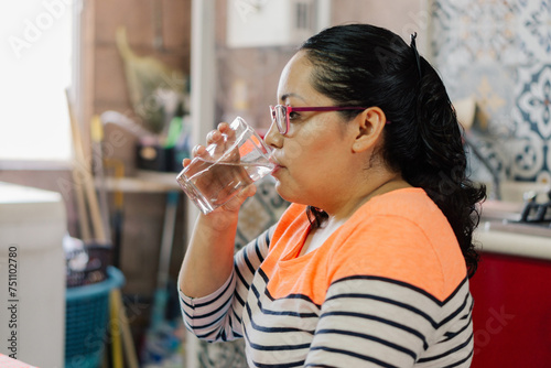 Woman drinking water. photo