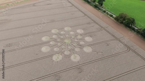 Enigmatic and mysterious crop circle in farm land. Aerial arc photo