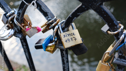 Love Padlocks on handrail by canal in London photo