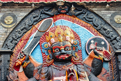 Kaal Bhairav - An open air temple with a powerful manifestation of the Hindu god Shiva built in black stone by King Pratap Malla  at the center of the historic Durbar square in Kathmandu,Nepal photo