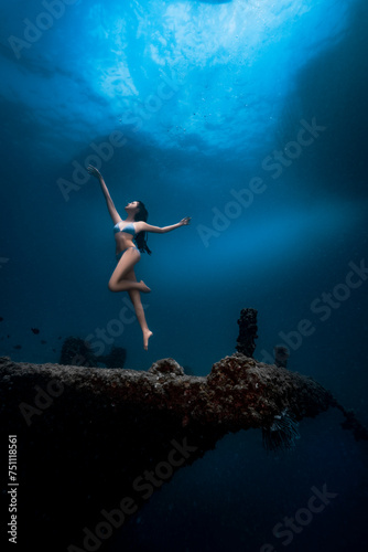 Female dancing underwater photo