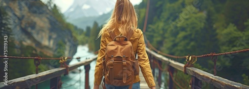 Walking along the picturesque bridge is a pretty young lady travelling with a rucksack.