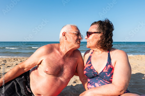 Happy senior Couple Having A Good Time On The Beach photo