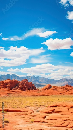 Panoramic landscape view of beautiful red rock canyon formations during a vibrant sunny day