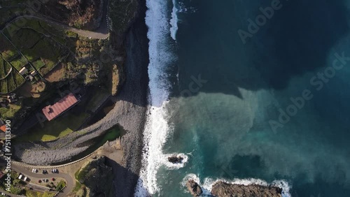 Immerse yourself in the surreal beauty of Madeira's cliffside scenery captured from a unique aerial viewpoint photo