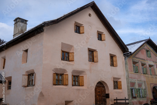 Part view of a traditional Engadine house of the historic village of Guarda (1,653 meters above sea level), Switzerland, from the 17th century