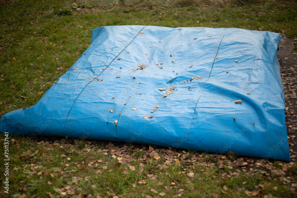 Blue awning. Rolled up awning in nature. Rain protection.