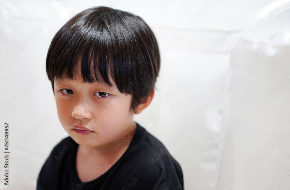 Close up Asian little boy, crying emotionally at home Close up Asian little boy, crying emotionally at home