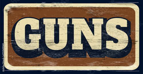 Aged and worn guns sign on wood